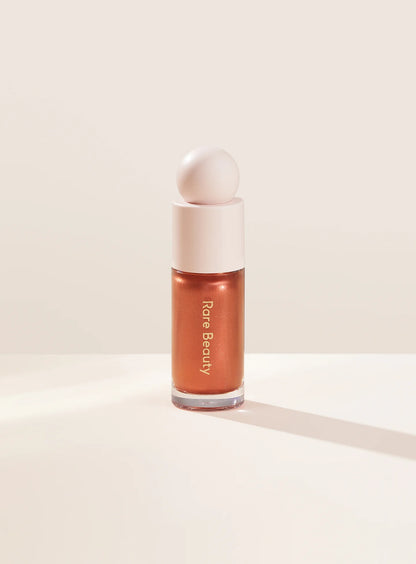 Positive Light Liquid Luminizer highlighter for a dewy, radiant glow on all skin tones. Shop Now at VIMP BEAUTY
